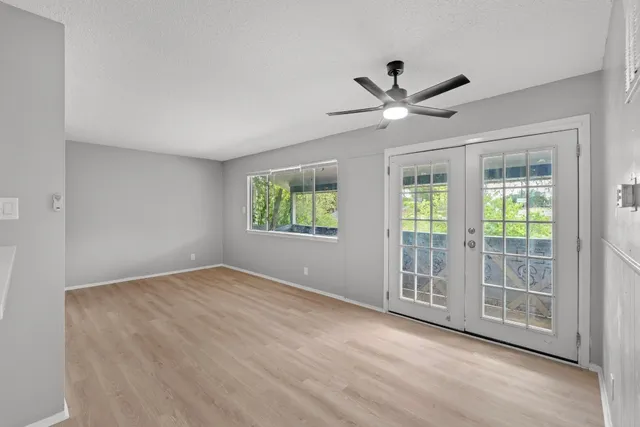 a view of an empty room with a window