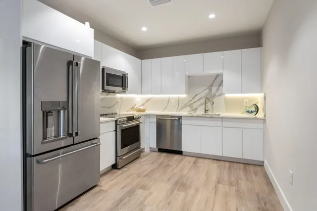 a kitchen with a sink and a microwave