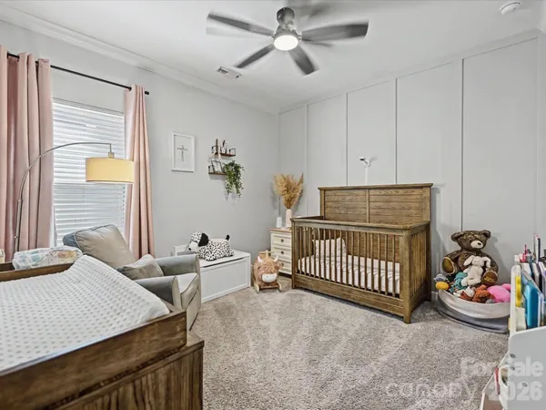 a bedroom with furniture and a window