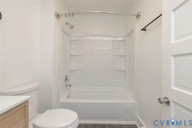 a bathroom with a shower and a toilet