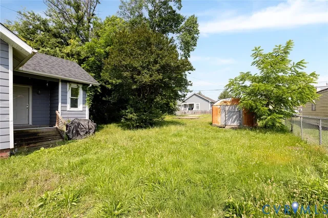a front view of house with yard and trees