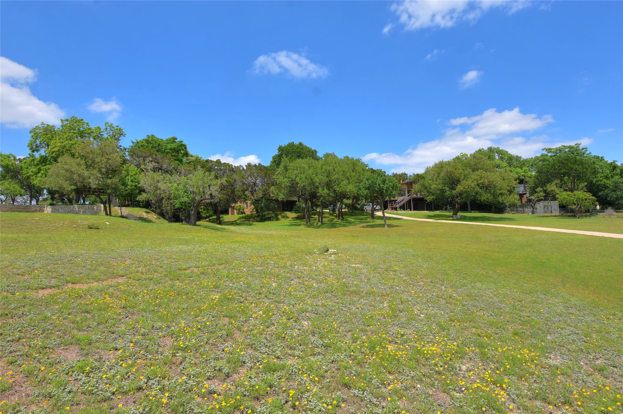 16013 Edwards Drive Austin, TX 78734 - Photo 24 of 30 Surrounding community with view of wooded area