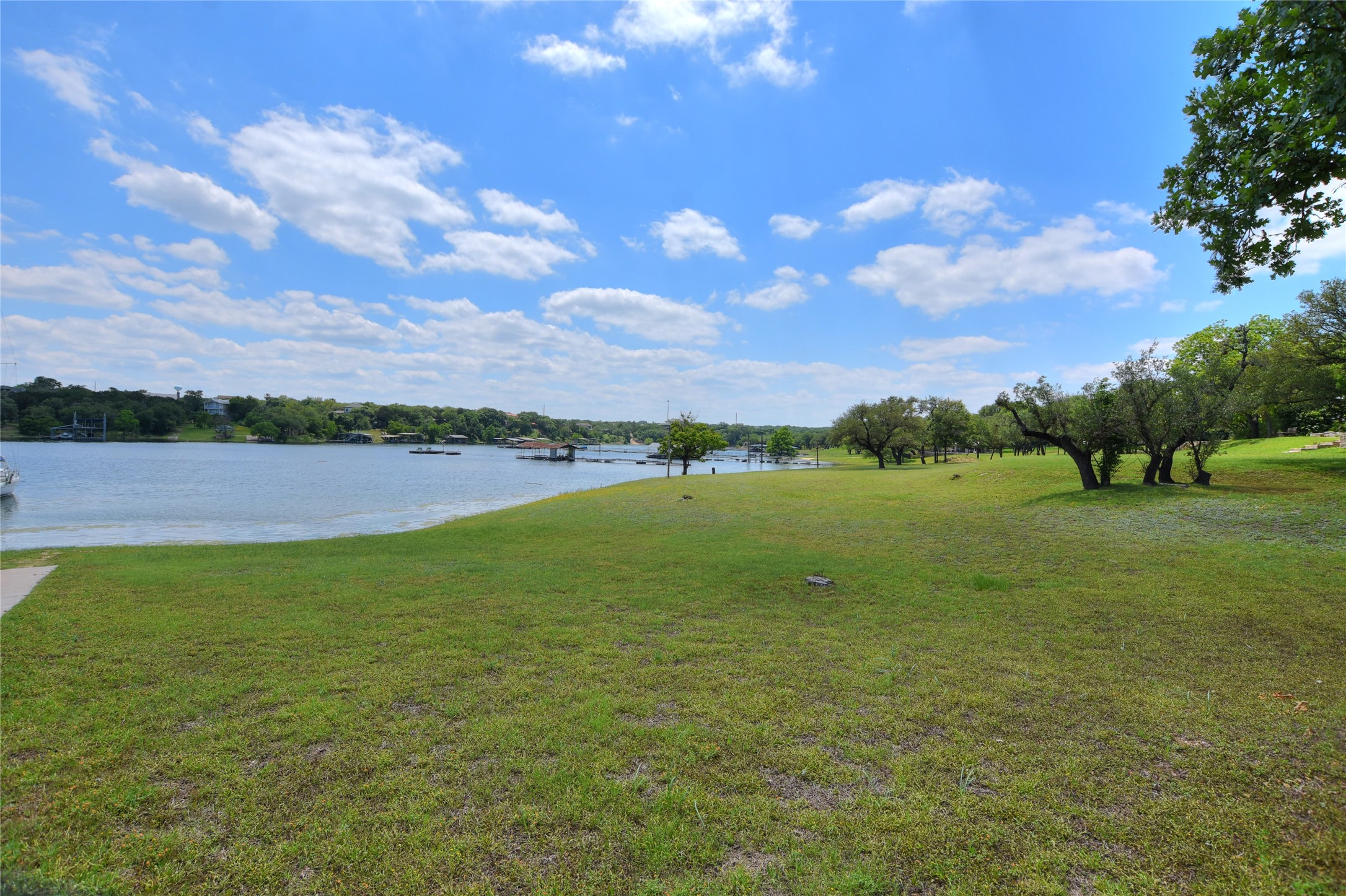 16013 Edwards Drive Austin, TX 78734 - Photo 25 of 30 View of grassy yard featuring a water view