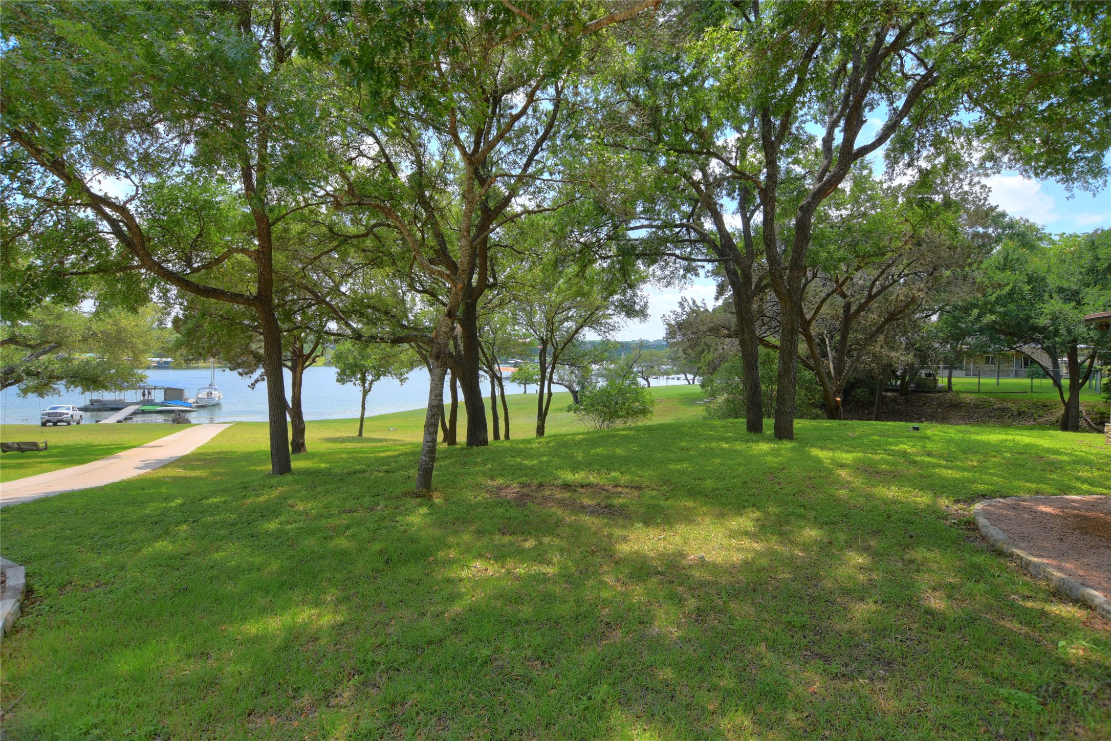 16013 Edwards Drive Austin, TX 78734 - Photo 29 of 30 View of grassy yard with a water view