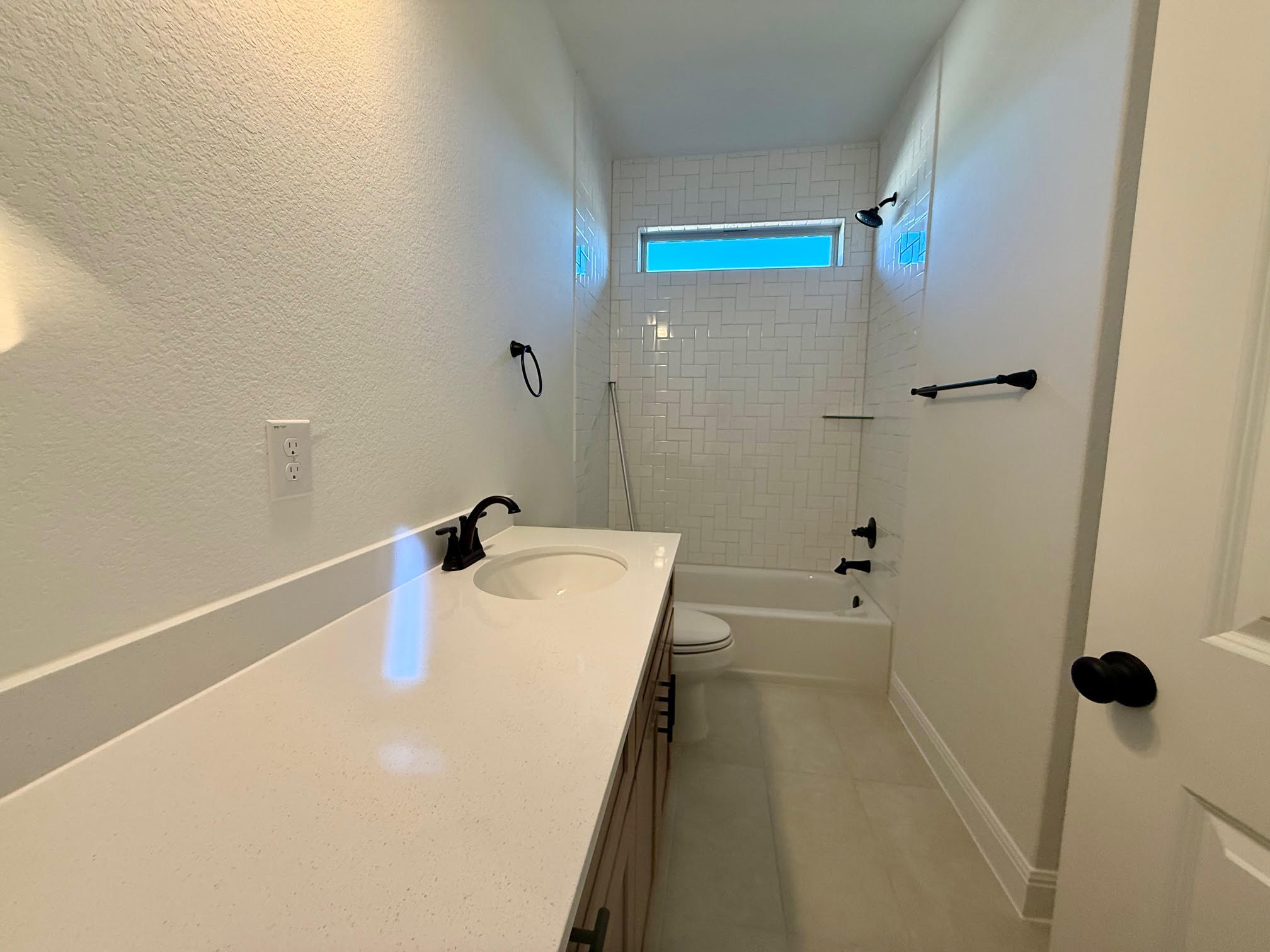 332 Glocken Lane Kyle, TX 78640 - Photo 18 of 27 a bathroom with a tub and shower