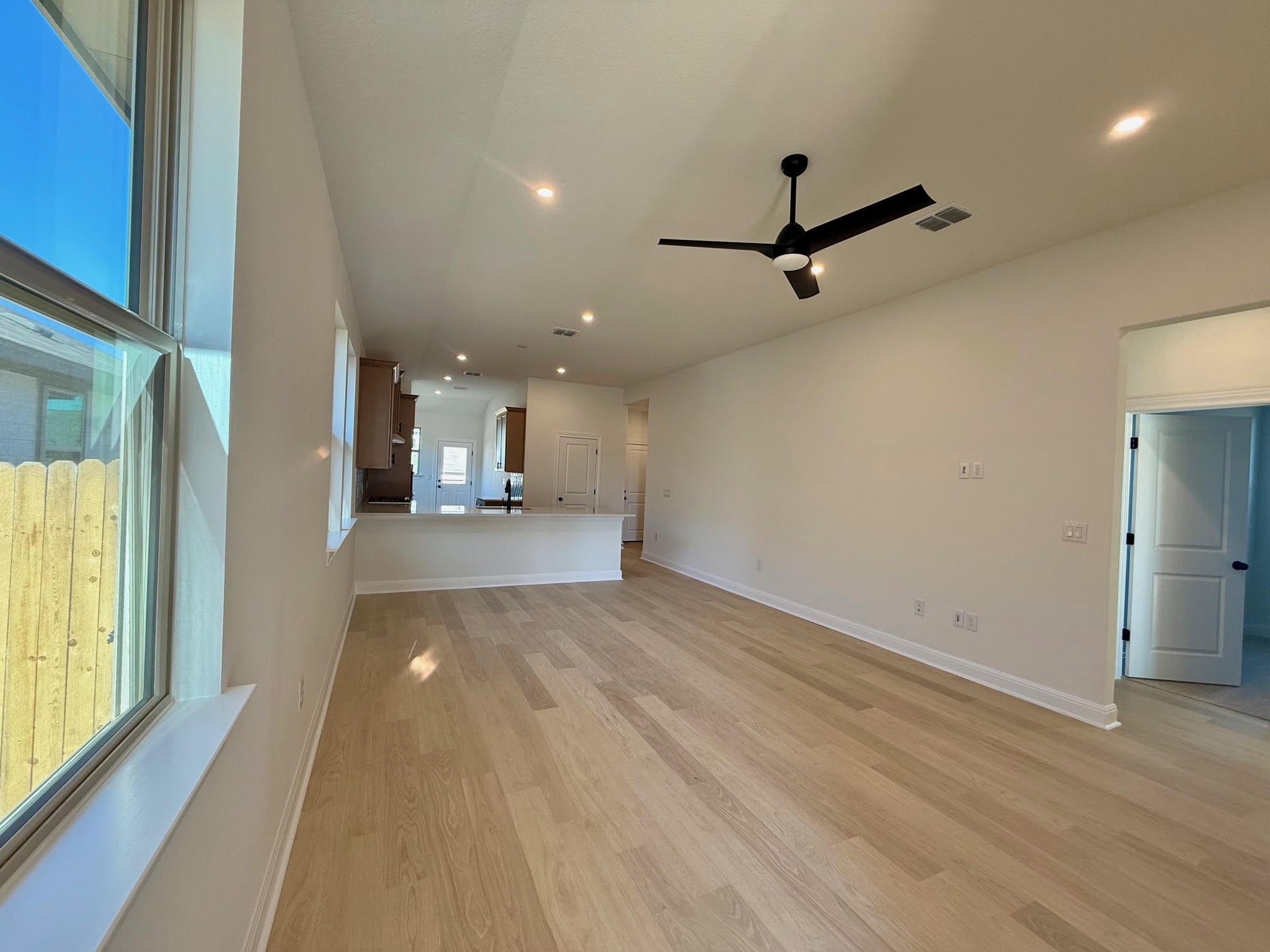 332 Glocken Lane Kyle, TX 78640 - Photo 2 of 27 a view of a livingroom with a ceiling fan and window