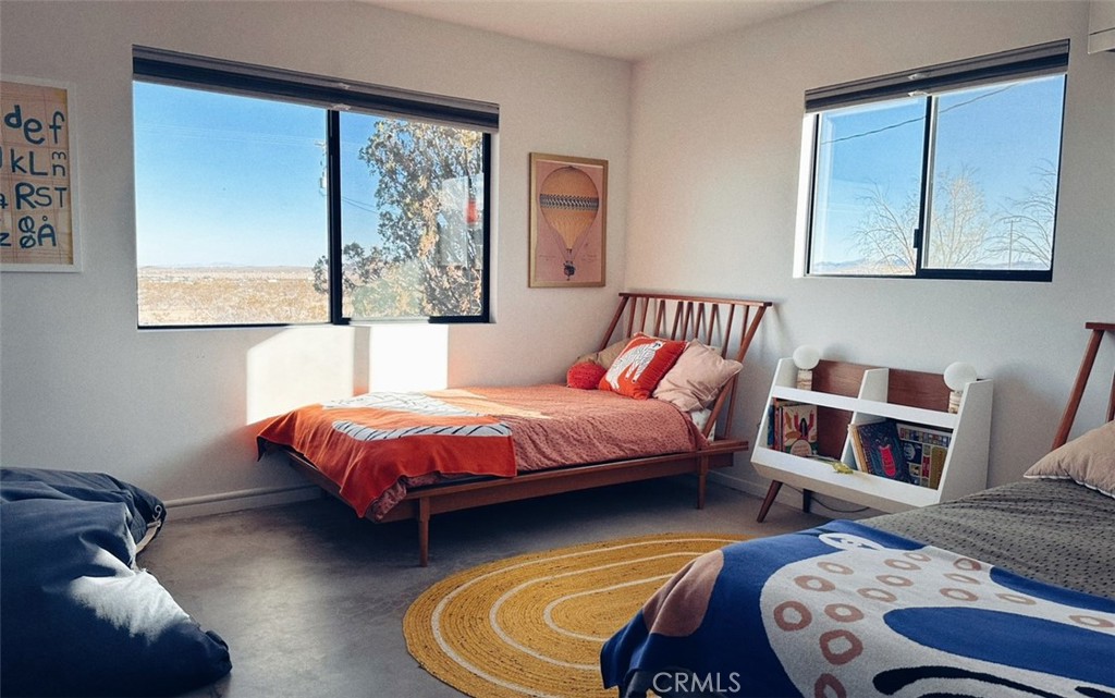 1212 Acoma Trail Landers, CA 92285 - Photo 12 of 23 a bedroom with a bed and window