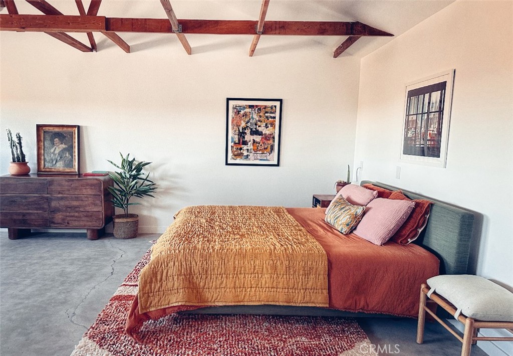 1212 Acoma Trail Landers, CA 92285 - Photo 20 of 23 a bedroom with a bed dresser and window