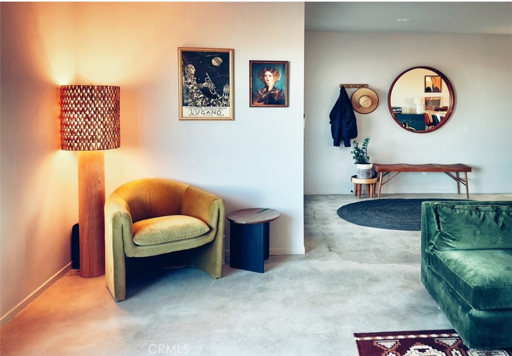 1212 Acoma Trail Landers, CA 92285 - Photo 4 of 23 a living room with furniture and paintings on the wall