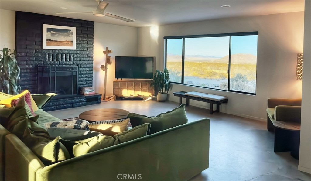 1212 Acoma Trail Landers, CA 92285 - Photo 5 of 23 a living room with furniture pool table and a flat screen tv