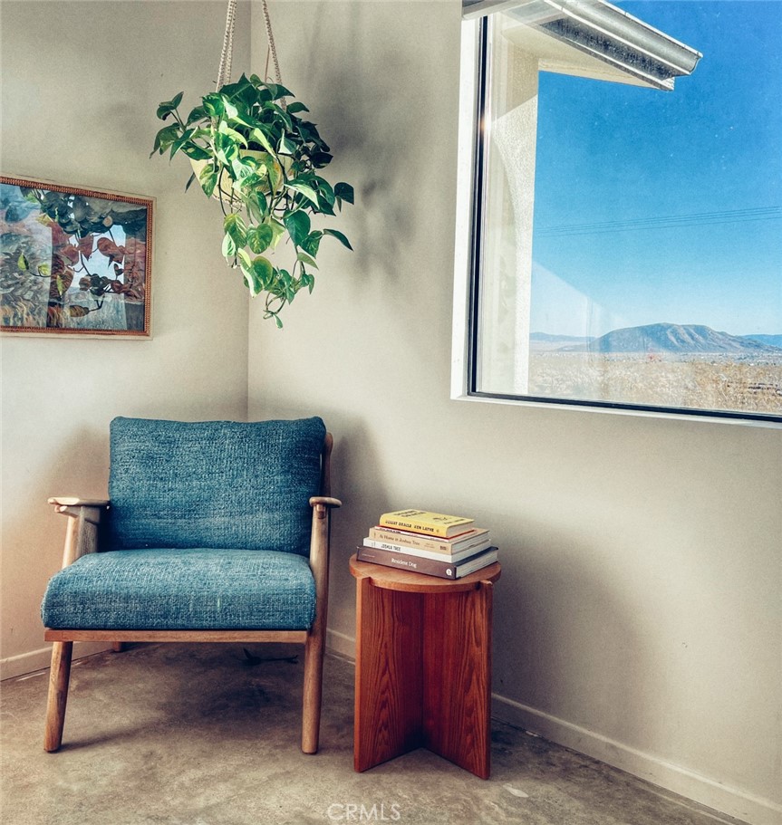 1212 Acoma Trail Landers, CA 92285 - Photo 7 of 23 a living room with furniture and a potted plant
