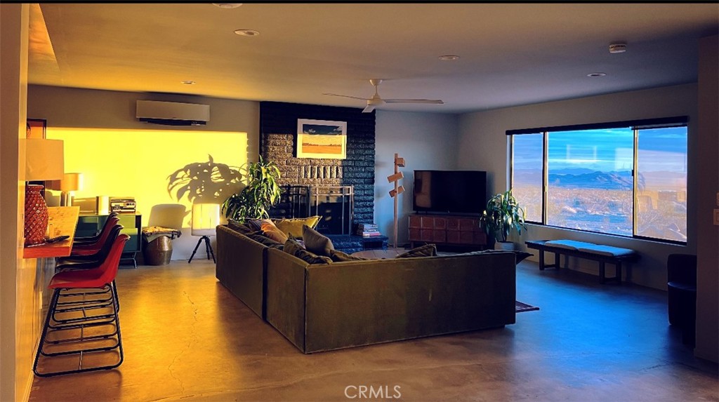 1212 Acoma Trail Landers, CA 92285 - Photo 8 of 23 a living room with furniture and a flat screen tv