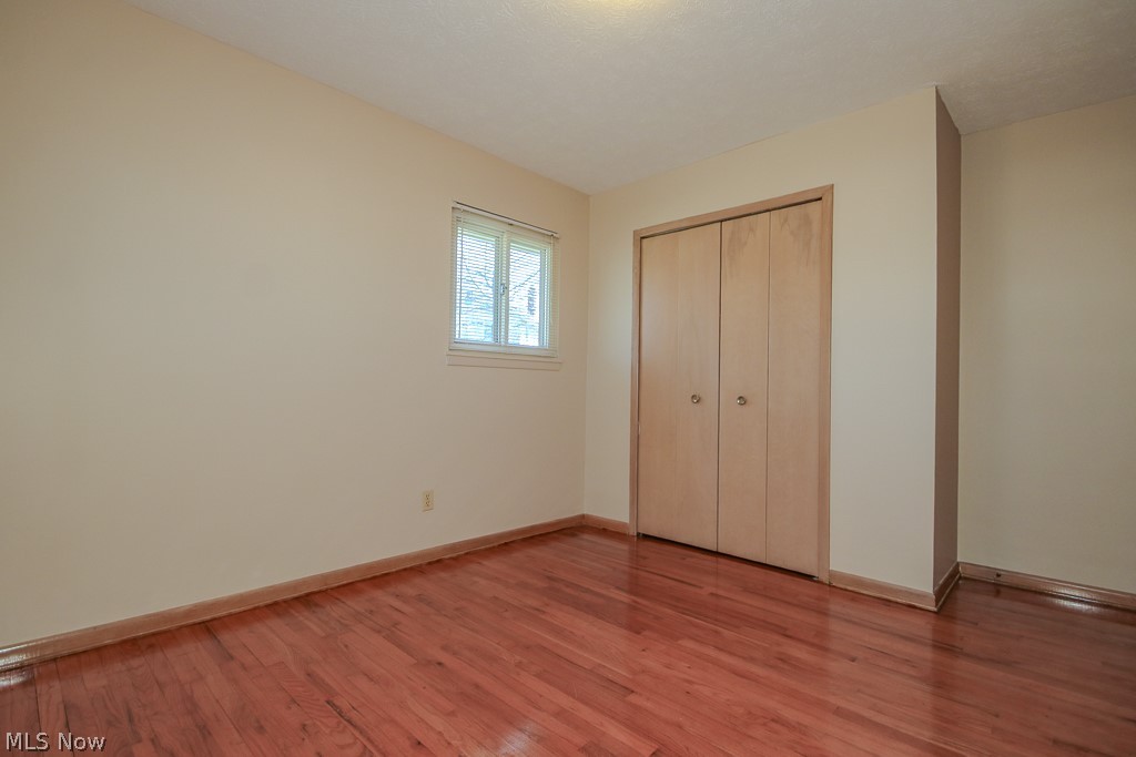 30224 Regent Road Wickliffe, OH 44092 - Photo 16 of 27 Unfurnished bedroom with light wood-type flooring and a closet