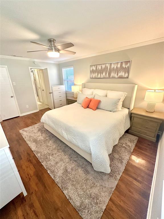 8415 Hunnicut Road Dallas, TX 75228 - Photo 9 of 17 a bedroom with a large bed and a wooden floor