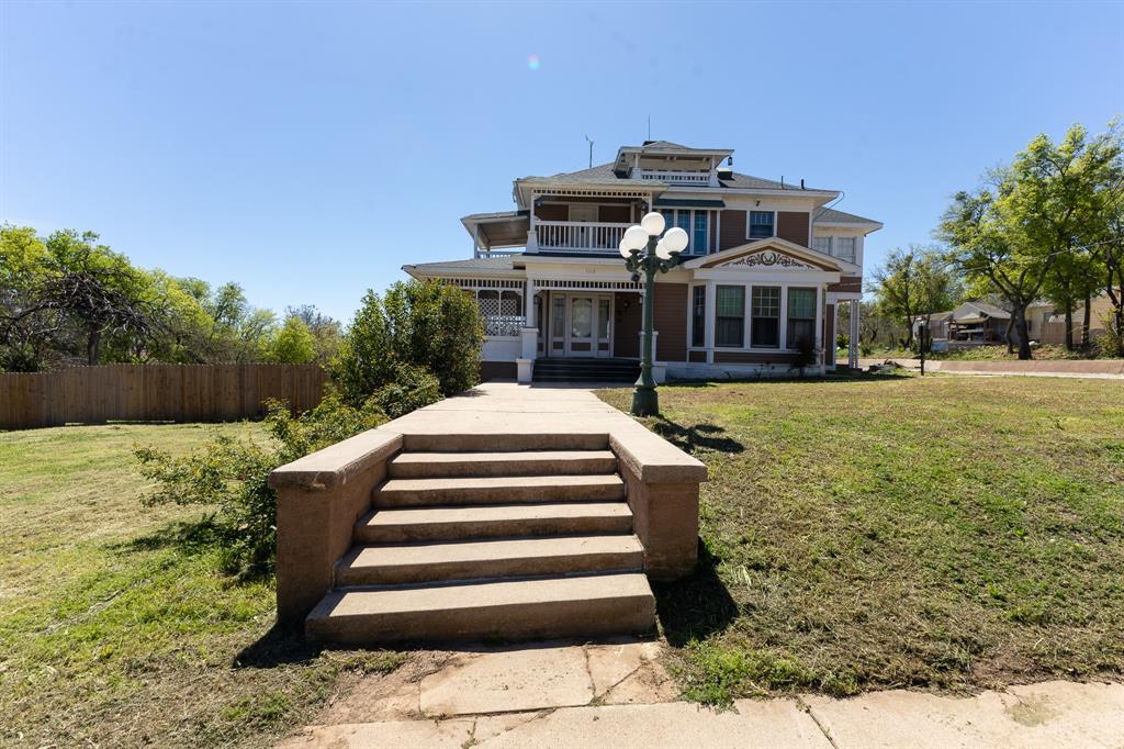 1115 Austin Street Coleman, TX 76834 - Photo 1 of 40 a front view of a house with a yard