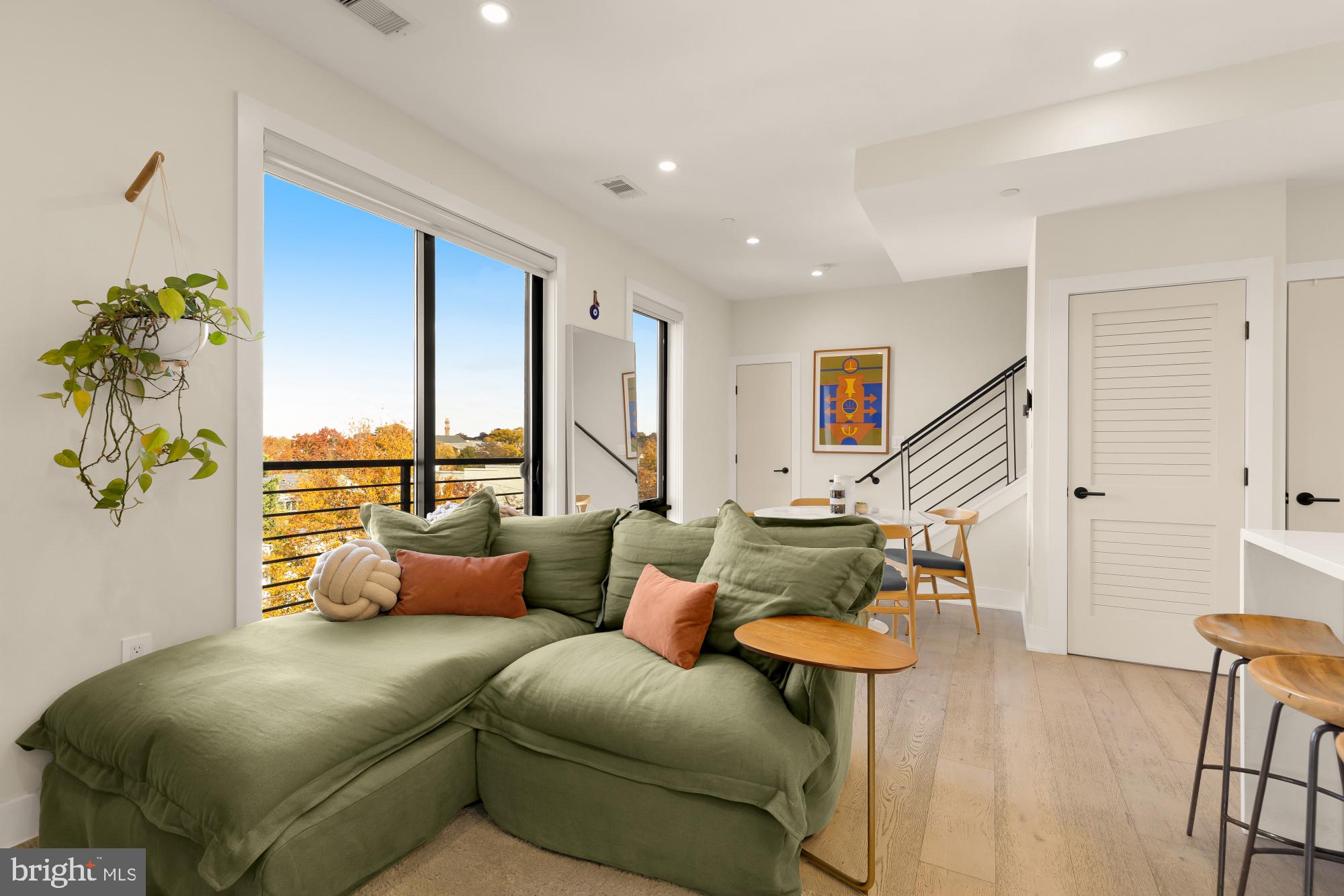 3933 14th Street Northwest, Unit 8 Washington, DC 20011 - Photo 11 of 28 a living room with furniture and wooden floor