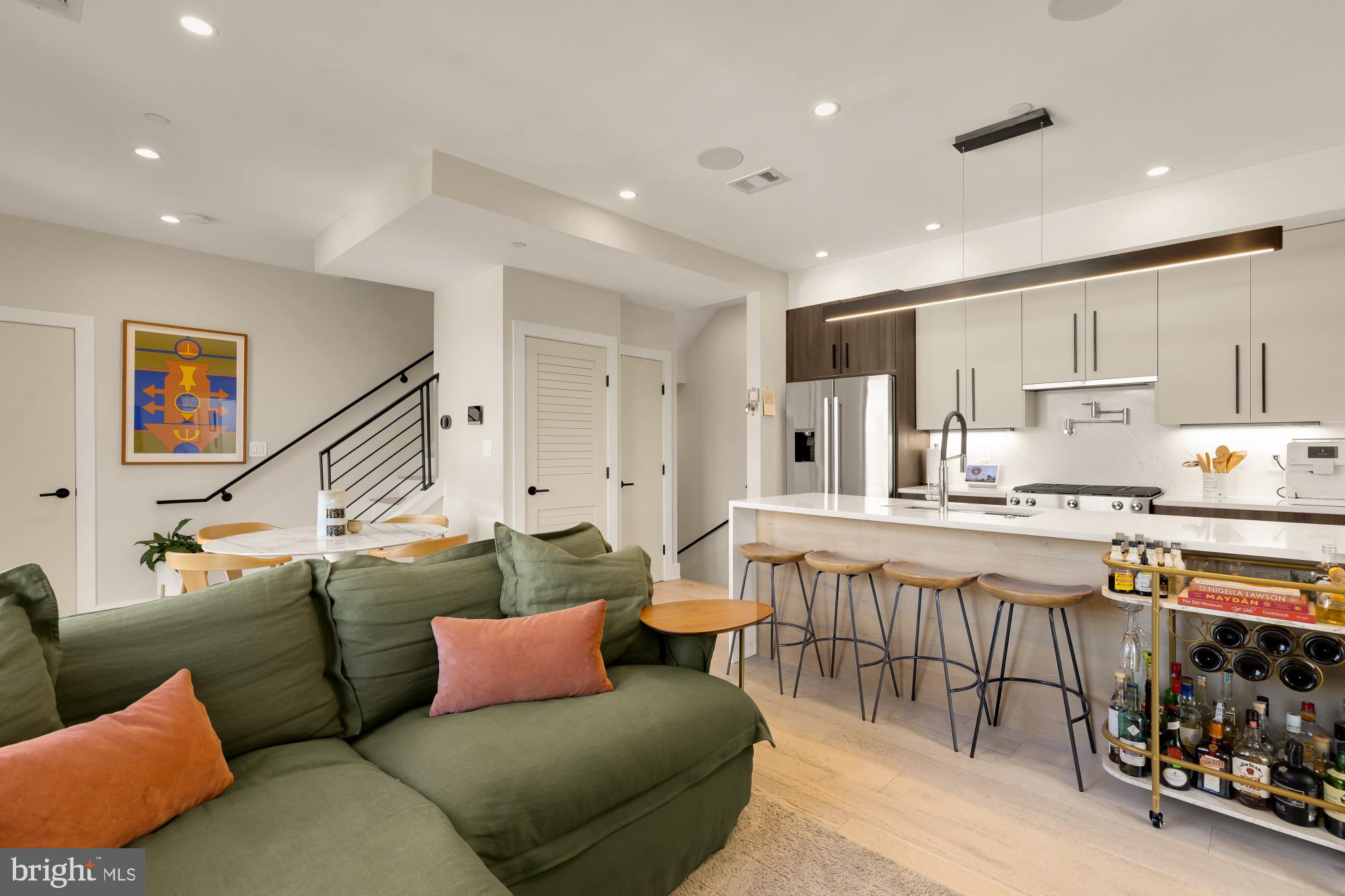 3933 14th Street Northwest, Unit 8 Washington, DC 20011 - Photo 12 of 28 a living room with stainless steel appliances furniture and a kitchen view