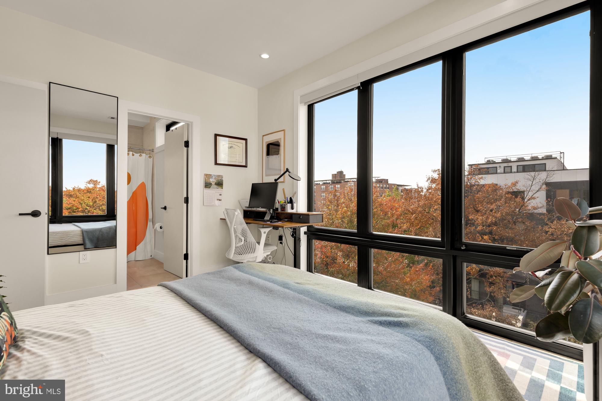 3933 14th Street Northwest, Unit 8 Washington, DC 20011 - Photo 15 of 28 a bedroom with a large bed and a large window