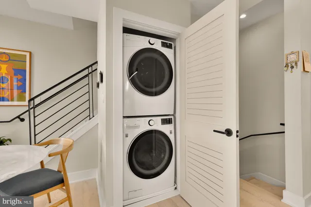 a bedroom with a bed and dresser with mirror