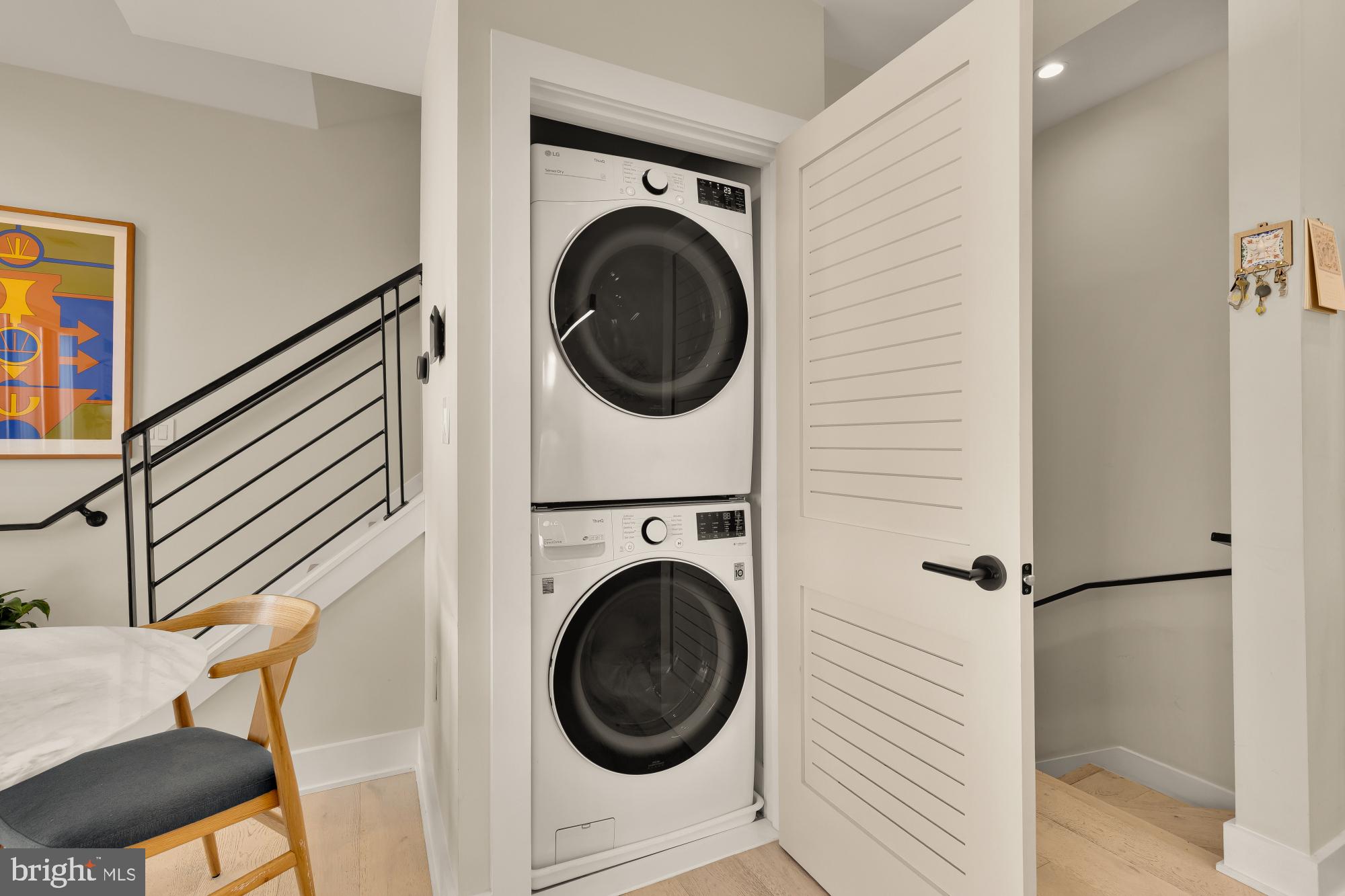 3933 14th Street Northwest, Unit 8 Washington, DC 20011 - Photo 18 of 28 a view of a hallway with washer and dryer
