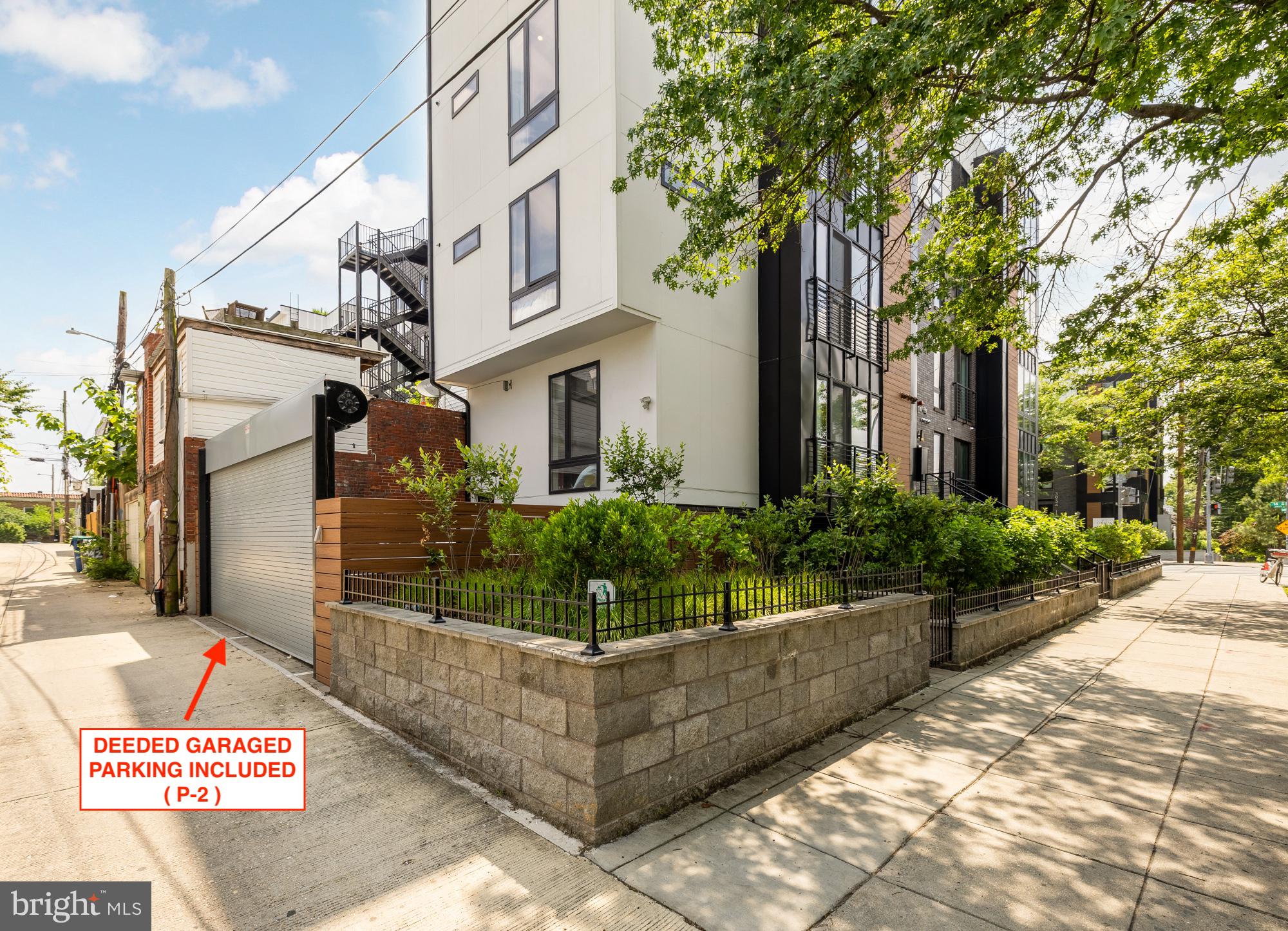 3933 14th Street Northwest, Unit 8 Washington, DC 20011 - Photo 25 of 28 a front view of a building with garden