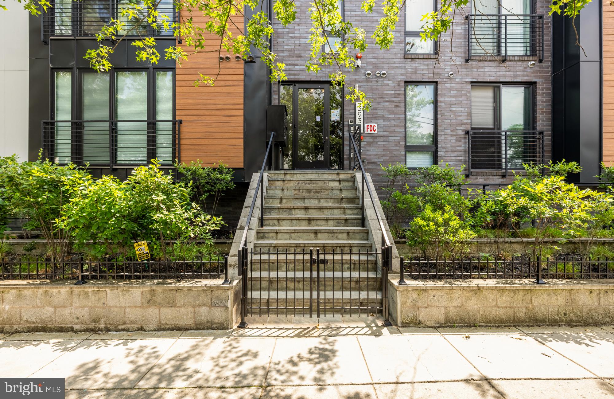 3933 14th Street Northwest, Unit 8 Washington, DC 20011 - Photo 26 of 28 a view of a building with potted plants