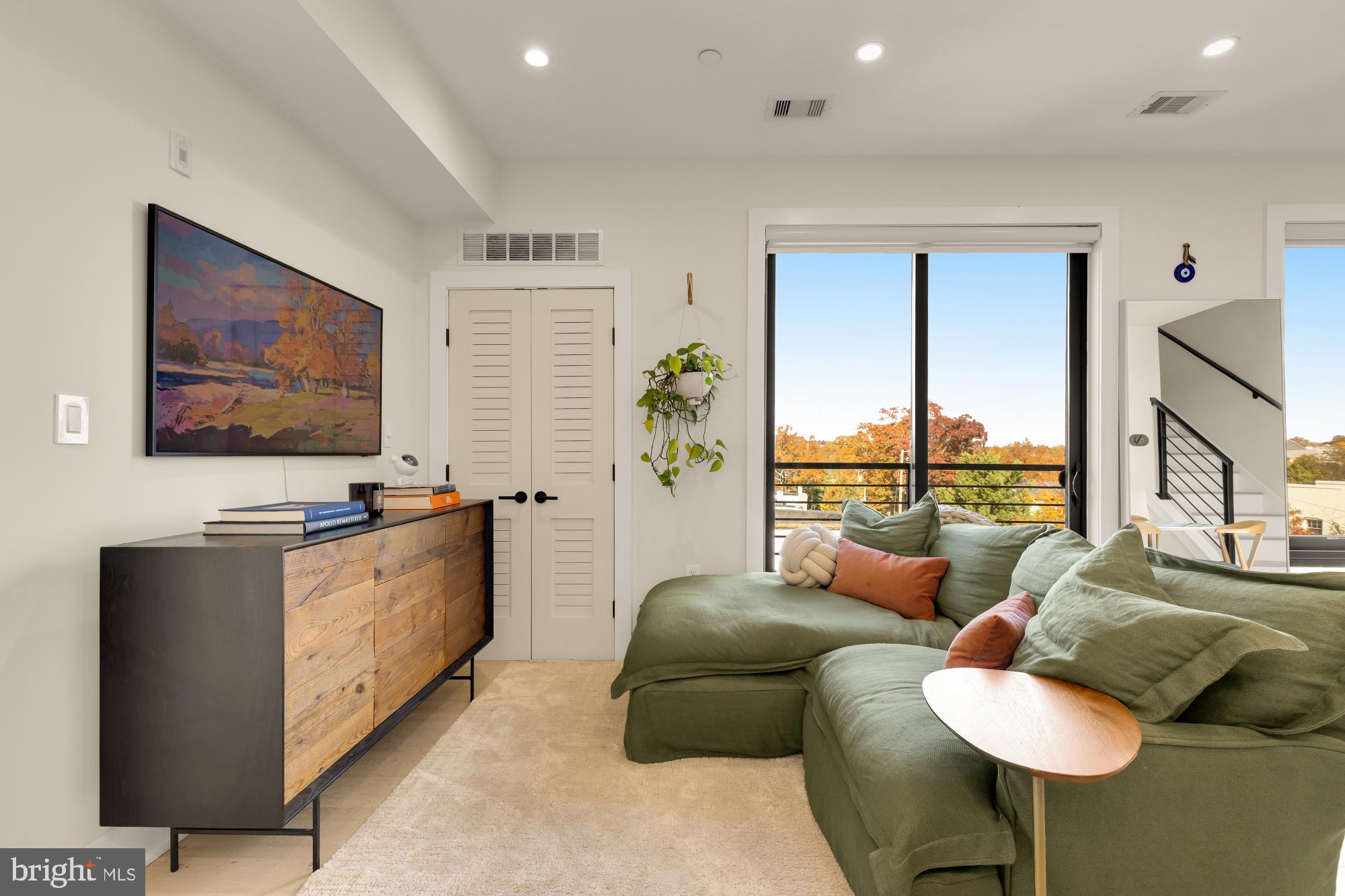 3933 14th Street Northwest, Unit 8 Washington, DC 20011 - Photo 10 of 28 a living room with furniture and a flat screen tv