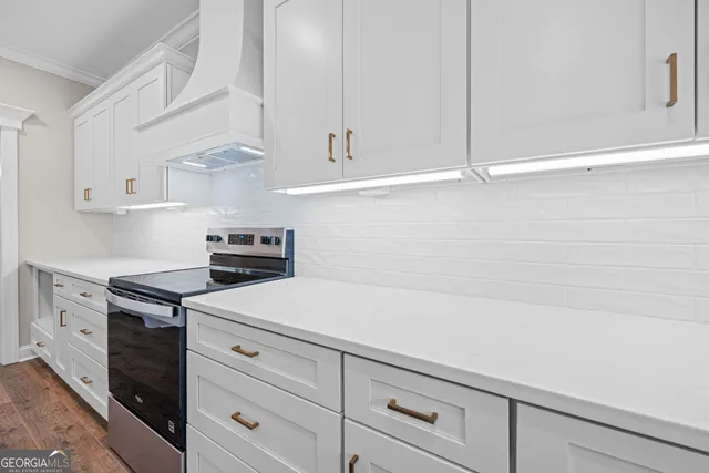 a kitchen with cabinets and appliances