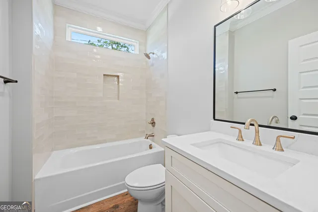 a bathroom with a sink a toilet and a bathtub