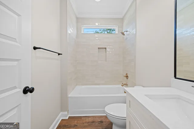 a bathroom with a toilet a sink and a bathtub