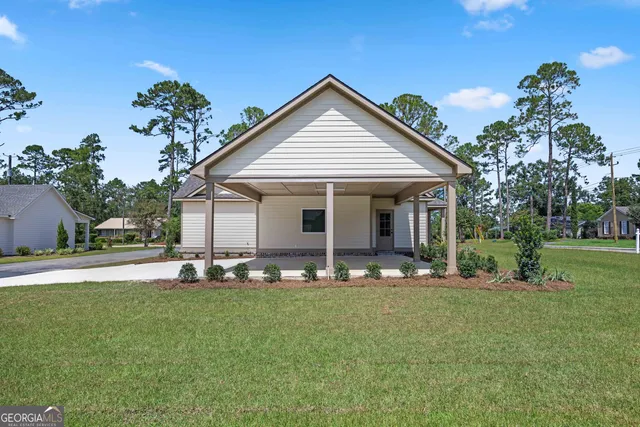 a front view of a house with garden