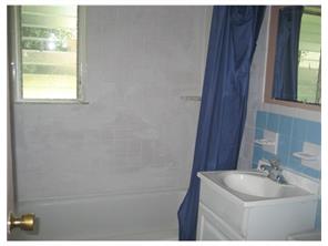 34 Idlewild Road Edison, NJ 08817 - Photo 2 of 7 a bathroom with a sink and a mirror