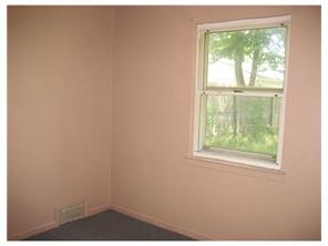 34 Idlewild Road Edison, NJ 08817 - Photo 3 of 7 a view of a window in an empty room