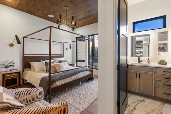 a bedroom with furniture and a window