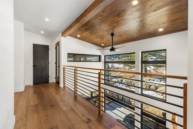 a view of a room with wooden floor
