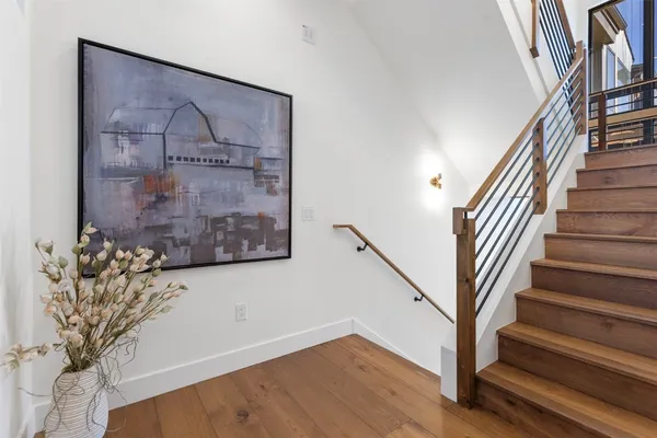 a view of entryway with wooden floor