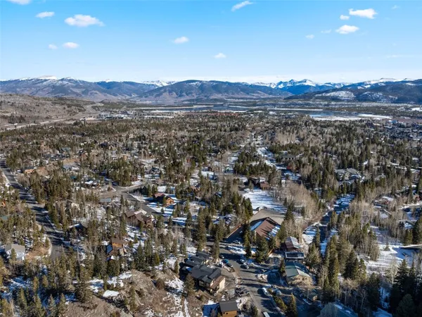 an aerial view of residential house and green space
