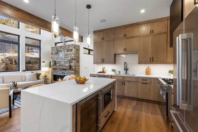 a kitchen with a sink stove and refrigerator