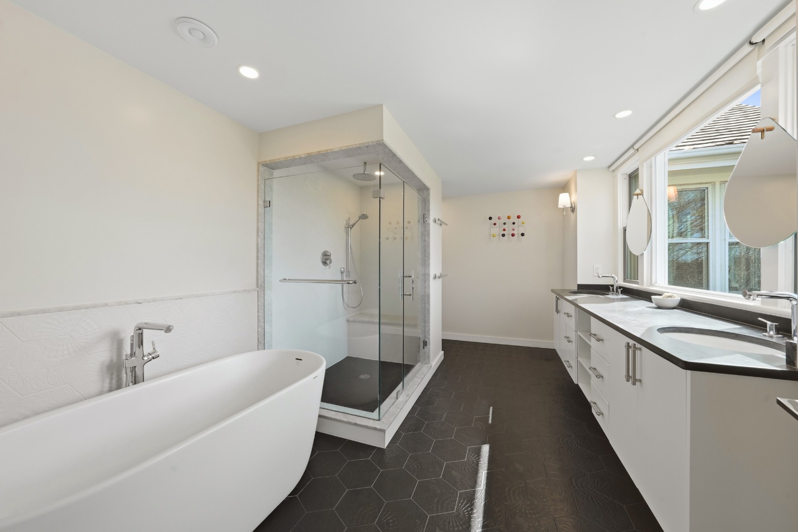 247 Polpis Road Nantucket, MA 02554 - Photo 20 of 52 a large white bathroom with a large tub sink shower and mirror