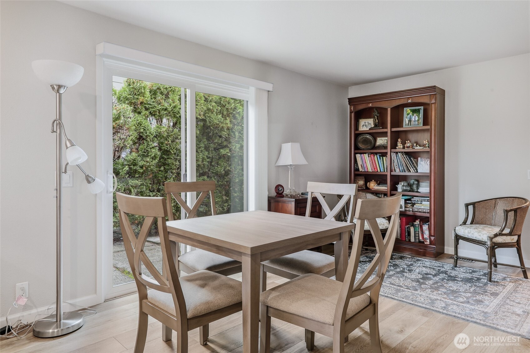 722 Wandering Creek Drive Bothell, WA 98021 - Photo 11 of 23 a view of a dining room with furniture window and wooden floor