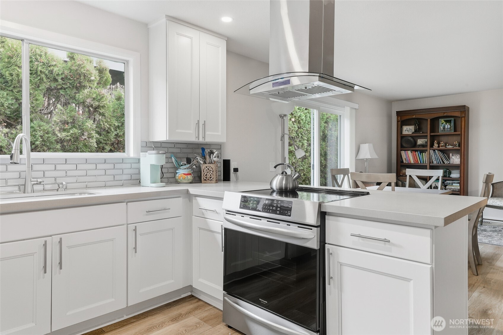 722 Wandering Creek Drive Bothell, WA 98021 - Photo 2 of 23 a kitchen with a stove cabinets and window