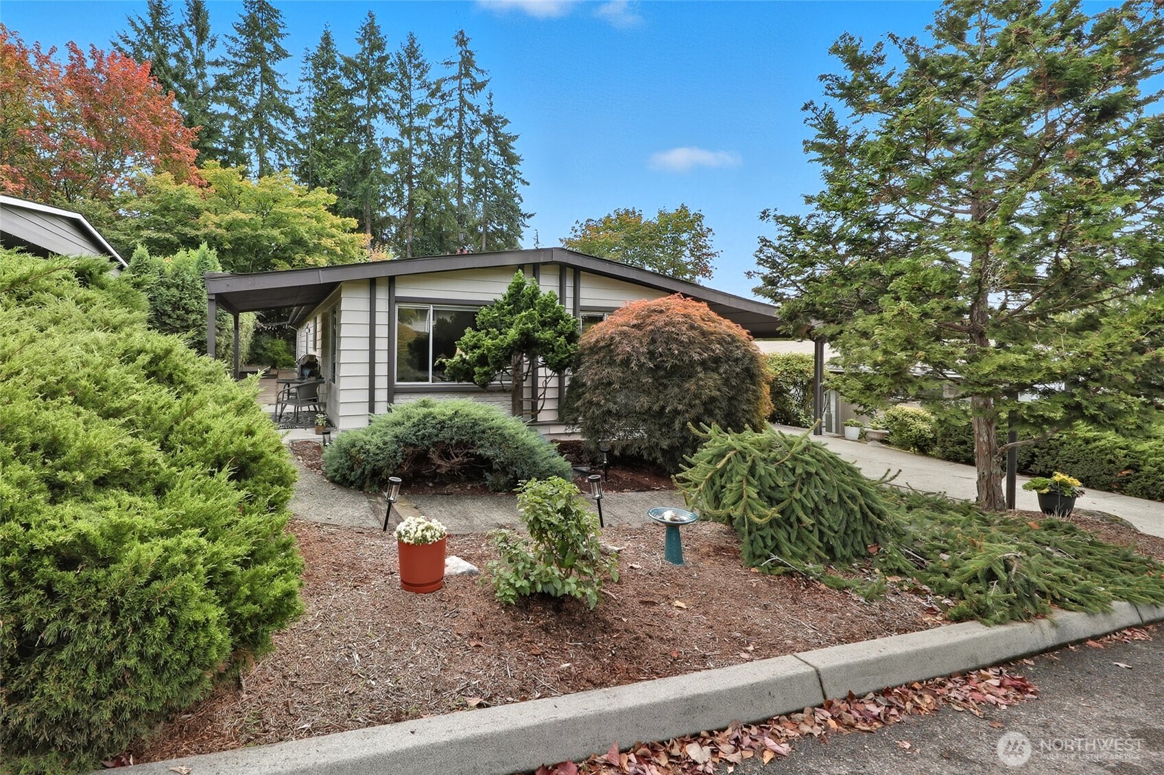 722 Wandering Creek Drive Bothell, WA 98021 - Photo 22 of 23 a front view of a house with garden