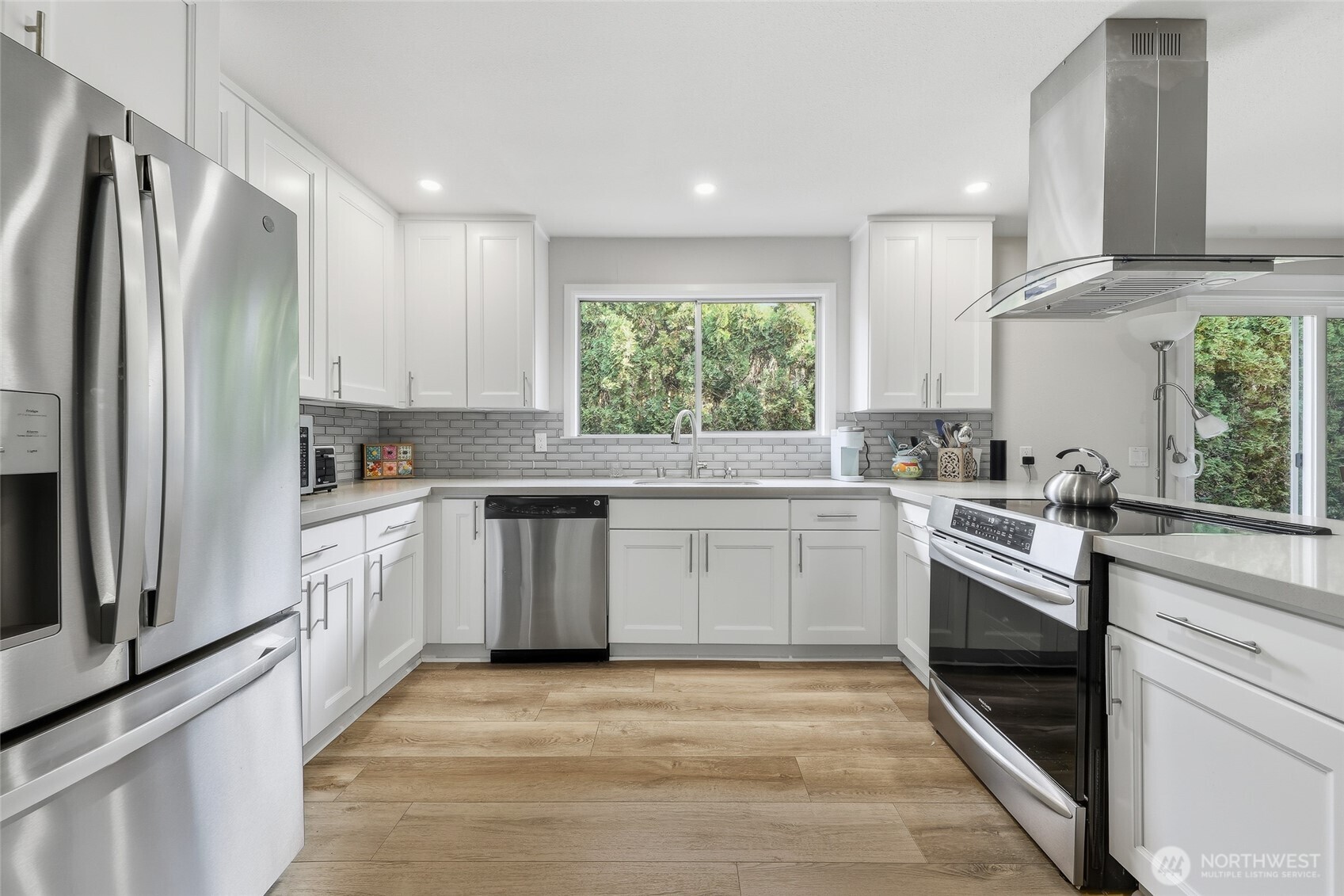722 Wandering Creek Drive Bothell, WA 98021 - Photo 4 of 23 a kitchen with a sink stove and refrigerator