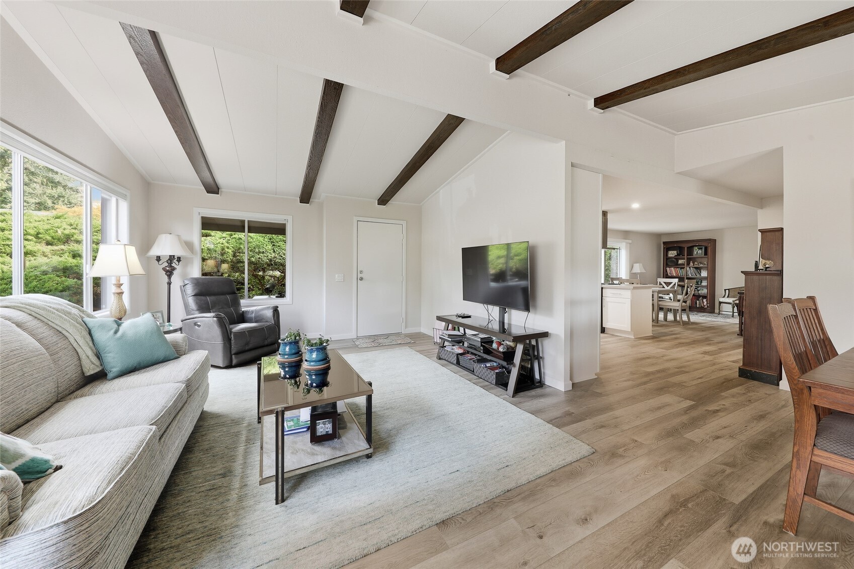 722 Wandering Creek Drive Bothell, WA 98021 - Photo 8 of 23 a living room with furniture and a flat screen tv