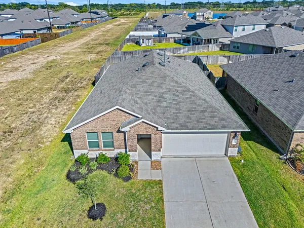 a aerial view of a house with a swimming pool