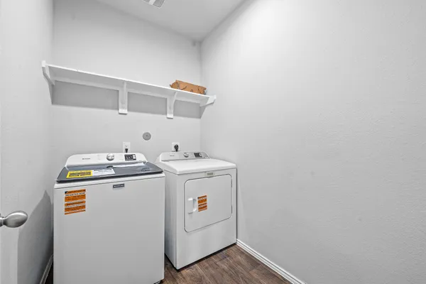 a utility room with dryer and washer