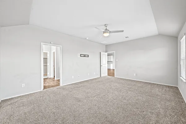 a view of an empty room with a window