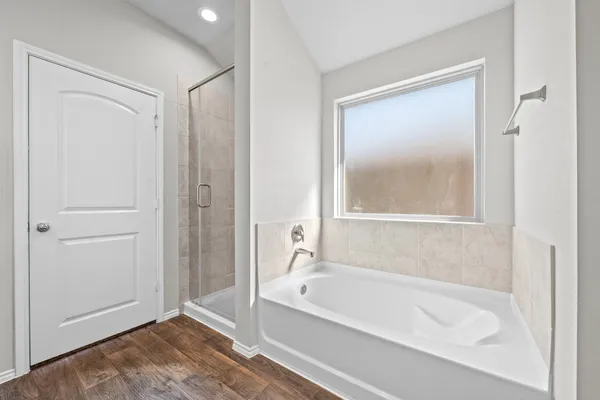 a bathroom with a double vanity sink mirror and shower