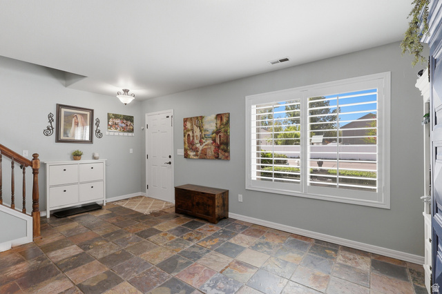 1652 West 800 South Lehi, UT 84043 - Photo 8 of 27 Entrance foyer with baseboards and stone tile floors