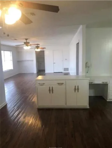 a view of cabinets and wooden floor